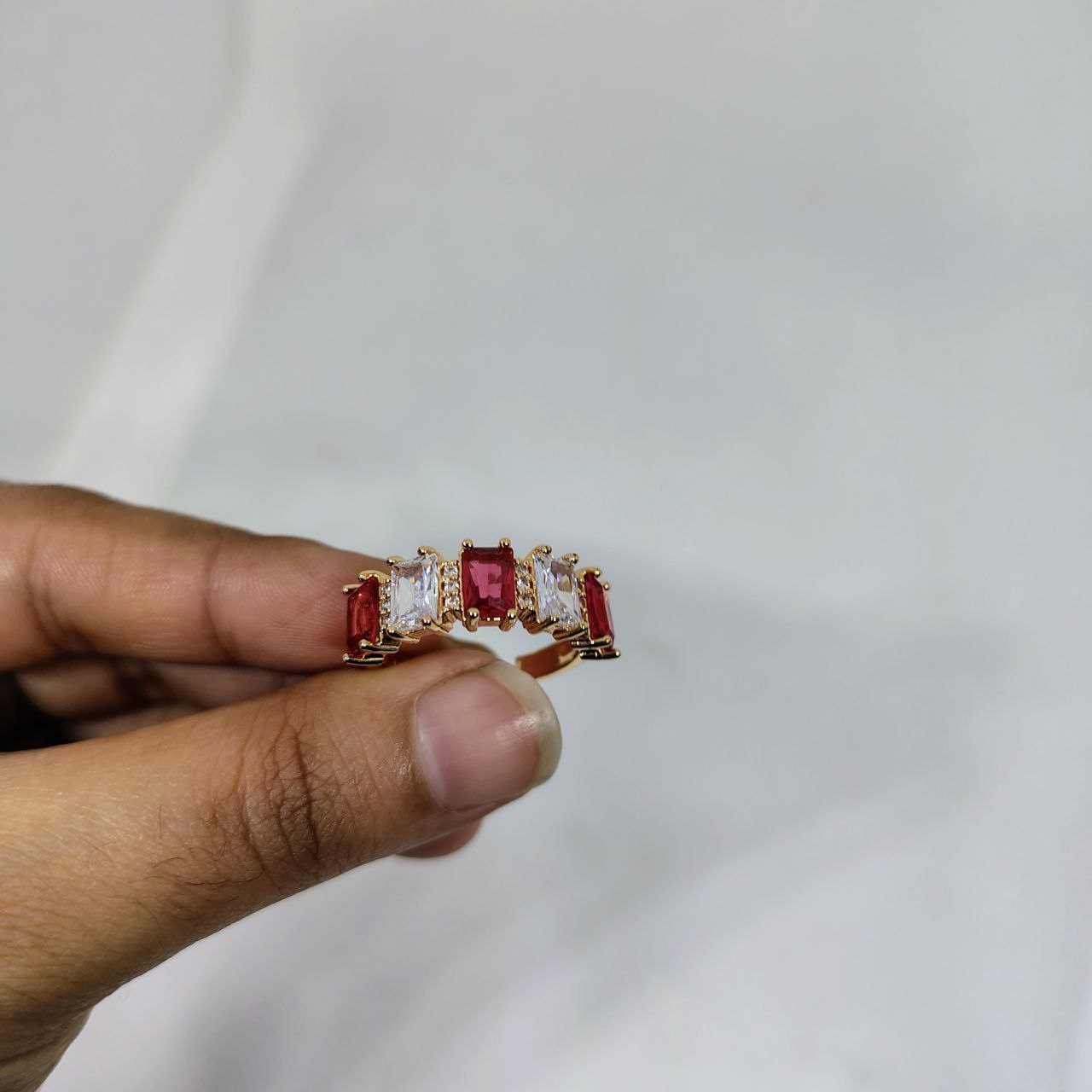 vibrant gold ring adorned with colorful gemstones