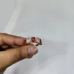 vibrant gold ring adorned with colorful gemstones