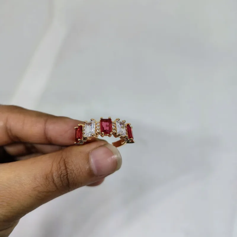 vibrant gold ring adorned with colorful gemstones