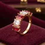 vibrant gold ring adorned with colorful gemstones