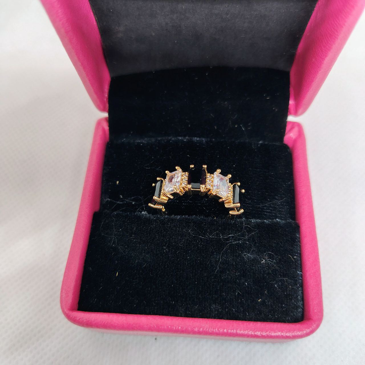 vibrant gold ring adorned with colorful gemstones.