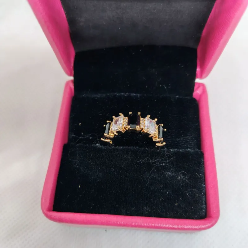 vibrant gold ring adorned with colorful gemstones.