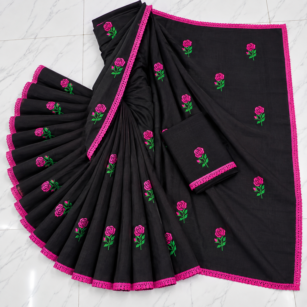 Exclusive glamorous black cotton saree featuring rose embroidery and a lace border.