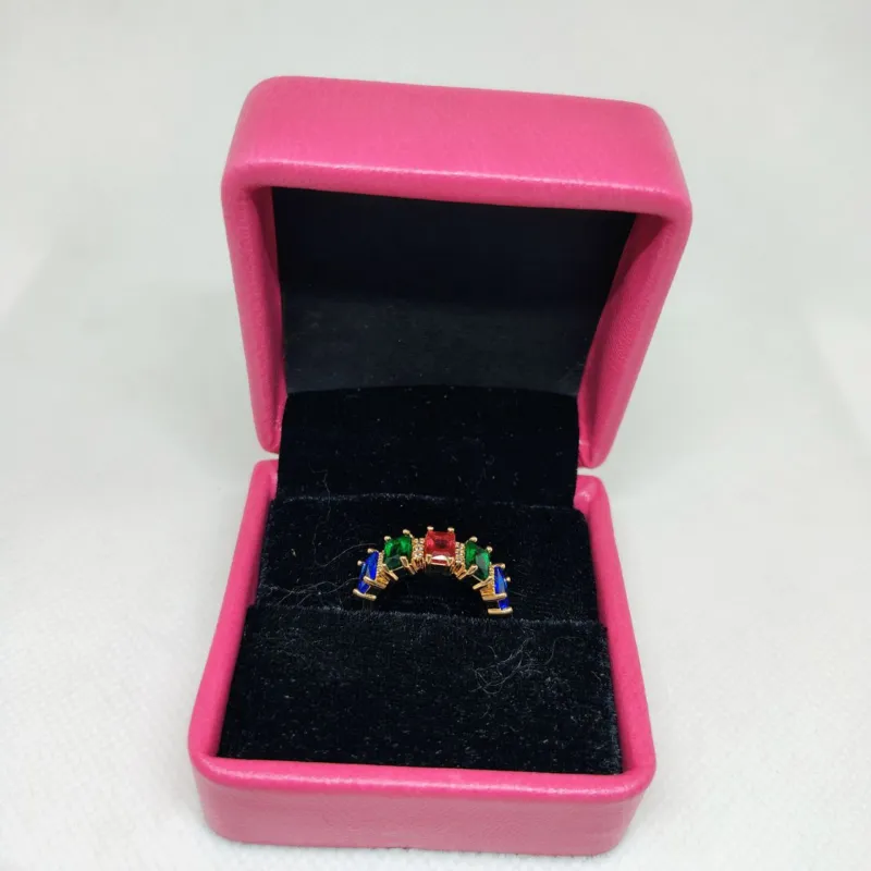 vibrant gold ring adorned with colorful gemstones,