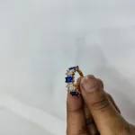 vibrant gold ring adorned with colorful gemstones,