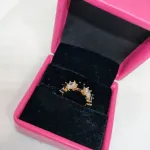 vibrant gold ring adorned with colorful gemstones.