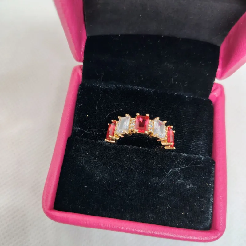 vibrant gold ring adorned with colorful gemstones
