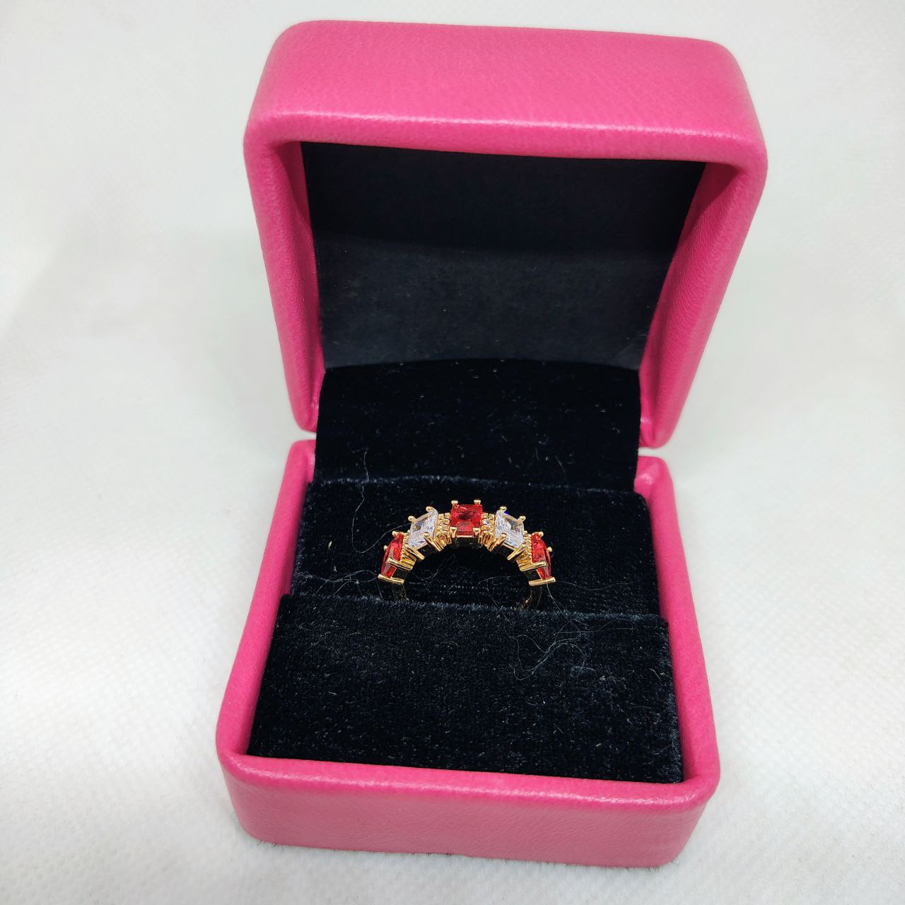 vibrant gold ring adorned with colorful gemstones