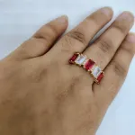 vibrant gold ring adorned with colorful gemstones