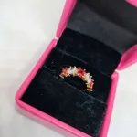 vibrant gold ring adorned with colorful gemstones