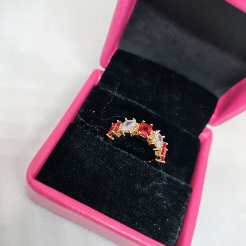 vibrant gold ring adorned with colorful gemstones