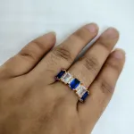 vibrant gold ring adorned with colorful gemstones,