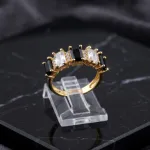 vibrant gold ring adorned with colorful gemstones.
