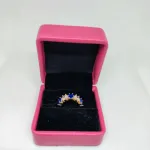 vibrant gold ring adorned with colorful gemstones,
