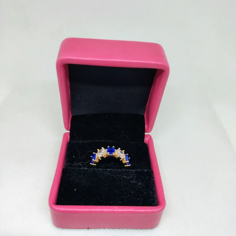 vibrant gold ring adorned with colorful gemstones,